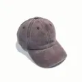 Detail view of the vintage washed denim baseball cap showing curved brim and eyelets. - Adjustable / Coffee