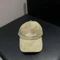 Close-up detail view of cotton corduroy baseball cap with mood embroidery and curved brim. - Adjustable / Light Green