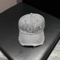 Detailed view of the vintage washed denim baseball cap featuring unique New York embroidery. - Adjustable / Gray