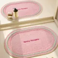 Pink oval bath mat with woven knit texture and cute text design for bathroom floor. - 40x60cm / Strawberry Jade Fruit