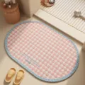 Pink checkered bathroom mat, absorbent oval bath rug with blue braided edge for home floor. - Pink Plaid