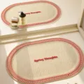 Cream woven oval bath mat faux linen absorbent anti-slip floor carpet with lettering - 40x60cm / Tomato Soft Center