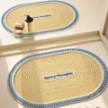Cream Woven Oval Bathroom Mat Anti-Slip Bath Rug with Blue White Border Spring Thoughts - Deep Sea Cone