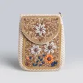 Boho straw phone bag detail, featuring intricate beaded patterns, shell flowers, and colorful stone accents. - Straw Crossbody Bag No.9