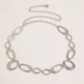 Detailed close-up of retro silver metal chain belt featuring textured oval links and tail. - Style A6 / Silver