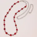 Close-up detail of silver waist chain with red oval rhinestones, elegant fashion accessory. - Red Rhinestone Belt D