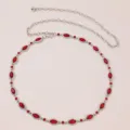 Detailed shot of sparkling red rhinestone waist chain with silver metal links and chain. - Red Rhinestone Belt E