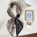 Close up detail view of the Maillard style patterned long silk scarf with magnetic buckle. - 04#-Houndstooth Print / One Size