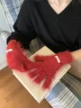 Detailed shot of vibrant red fuzzy split-finger touchscreen gloves with cute decorative tags. - One Size / Red