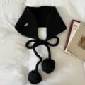 Detailed shot of Korean style black knitted pom-pom ear warmer and tie scarf for cozy winter. - Black