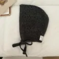 Dark grey knitted balaclava hat detail, hollow-out texture, tie-up ear-protecting hood. - Black Gray
