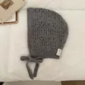 Grey knitted balaclava bonnet detail view, hollow pattern and side tie strings for cozy winter wear. - 06#-Grey