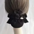 Detailed view of black fabric hair net bow with elegant lily of the valley pendant, back hair accessory. - Elastic Fine Net / Black
