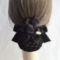 Black velvet hair net detail shot showing bow and lily of the valley pendant, professional bun. - Coarse Net / Black