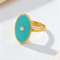 Bague ovale vintage en émail turquoise avec pierre de cristal centrale et bordure dorée polie. - Bleu Turquoise (JMX-JZ9873)