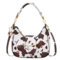 Vintage cow print hobo shoulder bag for women, stylish underarm purse with metal decor. - Coffee and White Cow Print / Coffee