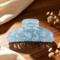 Blue acrylic hair claw clip featuring a vintage paisley floral print, perfect for elegant daily hairstyles. - Sky Blue