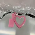 Pink glitter heart mirror and comb keychain detail close-up, sparkling bag charm and cute car accessory piece. - Heart Mirror and Comb / Pink