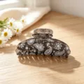 Detailed view of bohemian paisley print acrylic hair claw clip, vintage floral design for elegant styling. - Light Brown