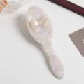 Pearlescent acetate hair brush with cute bow detail, smooth and portable daily styling tool. - Round Air Cushion Comb