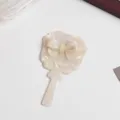 Acetate bow handheld makeup mirror detail view, elegant pearly finish cosmetic vanity tool. - Square Mirror