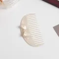 Acetate hair comb with elegant bow detail, vintage milky white pearl hair accessory for women. - Semicircle Comb
