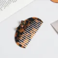 Tortoiseshell acetate hair comb featuring an elegant bow design for daily hairstyling. - Semicircle Comb / Tortoise