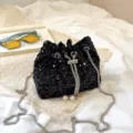 Black sequin bucket bag with stylish silver chain strap and pearl drawstring for evening party - Black