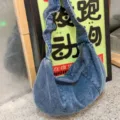 Casual blue denim shoulder bag for women, slouchy hobo crossbody bag with pleated design. - Blue