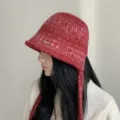 Red knitted bucket hat detail showcasing soft woolen material, cozy side ties and warm fit. - M (56-58cm) / Red