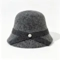Detail shot of grey wool bucket hat with elegant crisscross ribbon and pearl button accent. - M (56-58cm) / Dark Gray