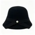 Detail view of black wool cloche hat with elegant ribbon and pearl button decoration. - M (56-58cm) / Black
