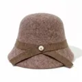 Closeup view of the stylish brown wool felt bucket hat featuring a chic ribbon and pearl button. - M (56-58cm) / Coffee