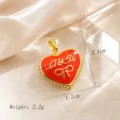 Gold plated red enamel heart pendant with bow design, elegant and charming jewelry piece. - Red Enamel Bow Heart (01)