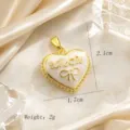 Gold-plated heart pendant with bow and cubic zirconia detail, elegant vintage jewelry. - Vintage Script Bow Heart (03)