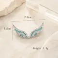 Connecteur de bijoux d'aile d'ange argenté avec des pierres de zircone vert et blanc scintillantes. - Argent Strass Vert Blanc