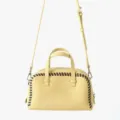 Sac à main Boston en cuir jaune avec détails de surpiqûres marron, poignées et bandoulière. - Jaune
