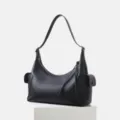 Black leather motorcycle shoulder bag with large capacity, soft hobo style and side pockets. - Black