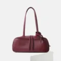 Burgundy leather bowling bag, stylish underarm shoulder handbag with long strap and dual zippers. - Burgundy