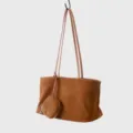Brown suede tote bag detail view, minimalist shoulder bag with hanging pouch and long straps. - Brown