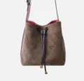 Brown suede quilted bucket bag with drawstring closure and stylish shoulder strap for women. - Green