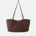 Detailed view of the brown suede tote bag showing the fine texture and leather handles. - Coffee