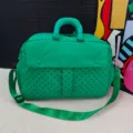 Large capacity green travel duffel bag with black polka dots, lightweight and portable. - Verdant