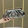 Dark grey metallic ruched clutch bag with gold frame and rhinestone clasp for evening party. - Gray