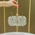 Elegant rhinestone evening clutch bag with pearl clasp and gold handle for parties. - Gold