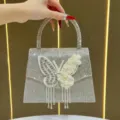 Borsa a mano con strass farfalla e frange floreali, elegante borsa da sera brillante. - Argento