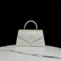 Stunning pearl rhinestone evening bag with twisted metal handle, elegant white party handbag. - Silver