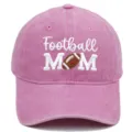 Close-up detail of pink washed baseball cap featuring embroidered football mom text design. - M / Pink