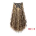Detail view of long curly clip-in hair extensions with highlights and secure clips. - #4H27