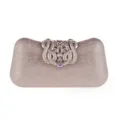 Detailopname van glinsterende glitter avondtas met sierlijke strass metalen sluiting. - Champagne